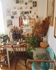 a room filled with lots of different types of plants and decorations on the wall above a wooden table