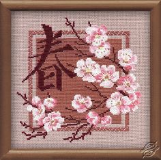 a cross stitch pattern with pink flowers on a brown background