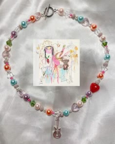 This GORG necklace is inspired by Beabadoobee's new album, Beatopia!! We ❤️ this necklace and hope you do too!! 16in long Message for questions Happy shopping🎀🎀 Billie Eilish Beaded Necklace, Ranboo My Beloved Locket, Rockstar Necklace, Diy Collier, Colorful Necklace, Beaded Necklace Designs, Beading Jewelery, Inspired Necklace, Diy Things