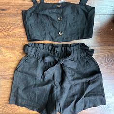 New Never Worn. Black Two Piece Set With Paper Bag, Tie Waist Shorts And Top. Straps Have Two Button Adjustment And Buttons In Front Are Functional. Size Medium. Black Casual Shorts For Going Out, Casual Black Shorts For Going Out, Black Bottoms With Buttons For Summer, Black Buttoned Bottoms For Summer, Black Shorts With Buttons For Spring, Chic Black Shorts With Buttons, Black Button Closure Shorts For Summer, Summer Black Bottoms With Button Closure, Black Two Piece Set