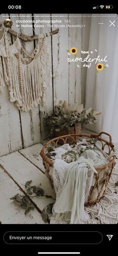 an old basket with sunflowers in it on top of a wooden floor next to a window