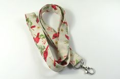 This cute lanyard has beautiful red birds. This lanyard is very beautiful in person. You can have a wardrobe of lanyard to match your outfit. This lanyard is made of soft 100% cotton fabric to give a comfortable feel around your neck. This lanyard is easy to take care. You can spot clean and throw in a washer and hang dry. If you want you can iron and it is ready to use. These lanyards are perfect if you have metal allergy. Each of these lanyards will have a slight different pattern depending on Adjustable Red Lanyard As Gift, Red Lanyards With Key Leash For Gifts, Red Lanyard With Key Leash As Gift, Cute Lanyard, Cute Lanyards, Patriotic Fabric, Fabric Lanyard, Red Bird, Have Metal