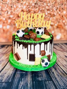 a soccer themed birthday cake with chocolate and marshmallows on the bottom layer