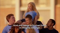 a group of people standing next to each other in front of a building with the words and evil takes a human form in regina george