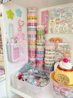 there are many different items on the shelf in this room, including washi tapes