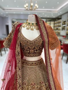 Feel like royalty on your special day with our Burgundy Gold Bridal Lehenga. The rich burgundy color is complemented by intricate gold bead work on the velvet blouse. The velvet border adds a touch of elegance to this beautiful lehenga. Stand out and make a statement with this luxurious piece. Fabric: Net with Raw Silk lining! WASH CARE INSTRUCTIONS - Please Dry clean only when it is applicable! Ready to Ship! Gold Bridal Lehenga, Beautiful Lehenga, Gold Lehenga, Latest Bridal Lehenga, Zari Embroidery, Velvet Blouse, Rich Burgundy, Designer Outfits, Velvet Blouses