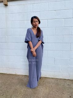 Embrace the gentle waves and sunny shores with our double gauze cotton kaftan in gray. This versatile floor-length kaftan falls gracefully just above the ankles (depending on your height), making it the perfect beach dress or cover up. Crafted from light and airy double gauze cotton, it's your essential for a night on the town, a day by the sea, or just running errands. Gray Maxi Dress For Spring Beach Outing, Bohemian Gray Maxi Dress For Summer, Casual Gray Maxi Dress For Beach, Flowy Linen Maxi Dress For Beach, Casual Gray Maxi Dress For The Beach, Oversized Linen Maxi Dress For Beach, Beachy Flowy V-neck Kaftan, Summer Beach Cover-up Dress In Cotton Gauze, Blue Cotton Kaftan For Beach Cover-up