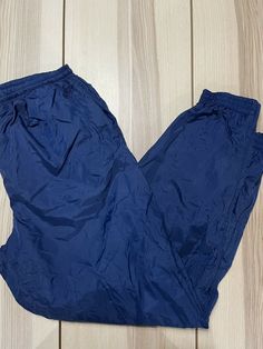 Vintage 90s Nike Blue Grey Tag Windbreaker Pants **Good condition. Small issues near crotch, zip on ankle. See pics for personal judgment** Simple yet classic Nike. These will forever be Nike’s staple. Everyone needs a pair in their collection. Measurements (laid flat) Inseam: 31” Length: 42.5” Nike Navy Bottoms For Streetwear, 90s Style Blue Bottoms With Pockets, 90s Blue Bottoms With Pockets, Windbreaker Pants, 90s Nike, Nike Blue, Blue Grey, Vintage 90s, Cute Outfits