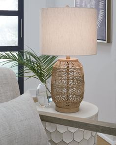 a table lamp sitting on top of a white table