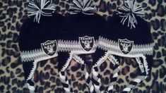 Beanies with ear flaps and braids. sport your team with this trendy warm beanie . custom made as well *main color  grey *main color  black *main color white Raiders Beanie, Oakland Raiders Hat, Nfl Caps, Crochet Owl Hat, Raiders Baby, Beanie With Ears, Nfl Raiders, Pixie Hat, Grey Trim