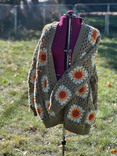 Wrap yourself in timeless style and cozy comfort with our Sunflower Granny Square Cardigan. This classic design features intricate crochet details that add a touch of vintage charm to any outfit. Whether you're dressing up for a special occasion or keeping it casual, this versatile cardigan is the perfect addition to your wardrobe. Experience the ultimate blend of fashion and comfort - get your Sunflower Granny Square Cardigan today Sunflower Granny Square Cardigan, Sunflower Cardigan, Sunflower Granny Square, Versatile Cardigan, Granny Square Cardigan, Square Cardigan, Intricate Crochet, Crochet Art, Crochet Details