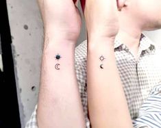 two people with matching tattoos on their arms