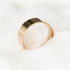 A gold-plated simple thick band provides extremely smooth wearing experience! It feels classic yet playful. Perfect as a friendship ring/wedding gift and easy to be stackable and versatile. A fabulous everyday ring! DETAILS: ☆ Crafted in Titanium Alloy and plated with rose gold. Nickel free. ☆ High Quality Ring that lasts its color and beauty over time. ☆ little over 1/4 in or 7mm thick. ☆ Comes beautiful packaged, in our branded Jewelry Box. Gift Ready. ☆ 3 sizes available: US 6, 7, 8. ☆ US siz Gold Thick Band Promise Ring, Gold Wide Band Ring For Promise, Gold Midi Rings With Thick Band, Gold Thick Band Ring As Gift, Gold Wide Band Ring As Gift, Gift Gold Thick Band Ring, Thick Band Ring With Simple Design For Gift, Gold Thick Band Minimalist Ring, Gift Rings With Simple Design And Thick Band