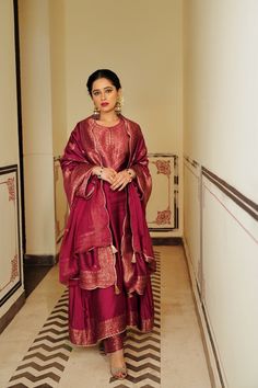 Featuring, a magenta monotone self-woven kurta. The shirt has self woven neckline and a thick border on the sleeves. The kurta has a coordinating border on the ghera, front and back. The shirt comes with light motif spread pants with a coordinating border on the hem. The dupatta has a motif spread with a scalloped border on the four sides. Fabric- Vegan SIlk Traditional Designer Slub Silk Kurta, Slub Silk Kurta For Traditional Ceremonies And Transitional Seasons, Transitional Slub Silk Kurta For Traditional Ceremonies, Festive Long Sleeve Tussar Silk Kurta, Transitional Season Straight Slub Silk Kurta, Transitional Long Sleeve Slub Silk Kurta, Semi-stitched Slub Silk Kurta With Long Sleeves, Designer Traditional Wear With Long Sleeves In Tussar Silk, Handloom Chanderi Straight Kurta