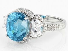 Pre-Owned 5.49ct Blue Zircon With 1.24ctw White Zircon And 0.15ctw Round White Diamond Rhodium Over 14k White Gold Ring. Measures Approximately 0.64"L X 0.48"W. .  This product may be a customer return, vendor sample, or on-air display and is not in its originally manufactured condition.  It may not be new.  In some instances, these items are repackaged by JTV. Accent stones primarily zircon. Rainbow Hair Color, Rainbow Hair, Blue Zircon, 14k White Gold Ring, White Gold Ring, White Gold Rings, Quality Jewelry, White Diamond, Gold Ring