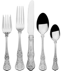 an assortment of silverware including forks, knives and spoons on a white background