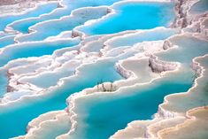 an aerial view of the blue water and white rocks in yellowstone national park, wyoming