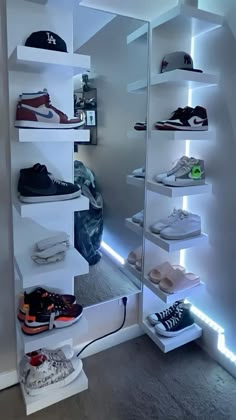 there are many pairs of shoes on the shelves