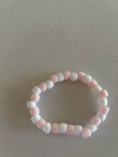 pink and white beaded bracelet Pink Pearl Bracelet With Colorful Beads, Cute Pink Beaded Stretch Bracelet, Pink Beaded Pearl Bracelet, Cute White Pearl Bracelet With Colorful Beads, Pink Beaded Pearl Bracelet With Round Beads, Cute White Bracelets With Colorful Beads, White Beaded Bracelet Jewelry, Cute Pink Beaded Bracelets With Colorful Beads, Cute Pink Bracelets With Colorful Beads