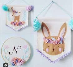 two pictures of bunny ears hanging on the wall and one has a monogrammed letter n