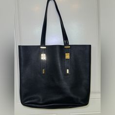 Beautiful India Hicks Pebble Leather Tote! Brand New Never Used. You Will Definitely Get Compliments On This Tote! No Scratches Awesome Condition! 15 1/2” Width X 14” Height X 3” Depth 3/4” Strap That Adjusts Between 7”, 9” Or 11”. Sample. Adjustable Straps. * How Has This Garment Been Treated: All Garments Are Washed Per Care Tag Except Nwt Or Dry Clean Only. All Items Are Cleaned, Stored In New Bags And Placed In Clean Bins, These Bins Are Stored Inside My Home. Your Purchases Are Removed From The Bags And Reviewed Prior To Shipping To Ensure Garments Are As Described In Listing, This Includes Confirmation That No Odor Or Scent Is Present On Garments. Garment Sprays Or Art Chic Bags With Brass Hardware For Work, Chic Work Bags With Brass Hardware, Elegant Tote Bag With Brass Hardware, Elegant Black Bag With Brass Hardware, Elegant Black Shoulder Bag With Brass Hardware, Elegant Black Bags With Brass Hardware, Chic Black Bag With Brass Hardware, Chic Black Bags With Brass Hardware, Elegant Shopping Bag With Brass Hardware