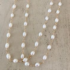 RICE PEARL NECKLACE LONG – POSHMIRA Spiritual Single Strand Pearl Necklaces, Pearl White Oval Beads Jewelry Gift, Pearl White Oval Beads Jewelry For Gift, Elegant White Hand-wrapped Necklace, Elegant White Hand Wrapped Necklace, Spiritual Pearl Chain Jewelry With Round Beads, Single Strand Pearl Jewelry With Oval Beads, Spiritual Single Strand Pearl Necklace, Pearl White Oval Beads Pearl Necklace For Gift