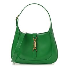 This is an authentic GUCCI Boarded Dyana Lux Calfskin Small Jackie 1961 Hobo in Emerald. Beautifully crafted of green calfskin leather, this bag features an adjustable looping shoulder strap, gold hardware, and the crossover strap. Front closure is reinforced by secure light gold piston and lock mechanism, opening to a beige microfiber interior with a zipper pocket. Green Leather Bag, Gold Hardware, Crossover, Zipper Pocket, Calf Skin, Emerald, Shoulder Strap, Gucci, Zipper