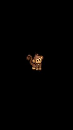 a monkey is standing in the dark with its head turned to look like it's holding something