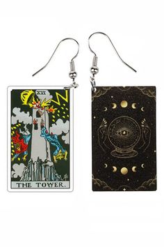 two taroti cards are hanging from earrings