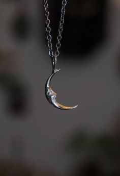 Sculpted entirely by hand, this moon is just over 2 centimetres tall and has a face that hints at a small smile. Elegant, discreet and very, very bright. The entire pendant is in 925 silver while the chain is in hypoallergenic stainless steel. Silver is nickel and lead free. Smiling Face, Moon Pendant, Smile Face, A Face, Silver Pendant, Jewelry Necklace Pendant, 925 Silver, Jewelry Necklaces, Moon