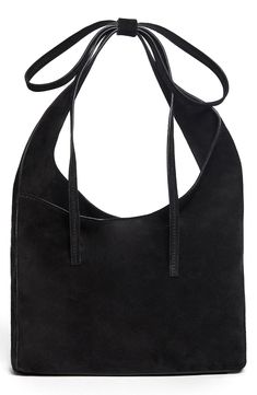 This small, slouchy leather tote with an asymmetric topline takes a subtle approach to the season's bow trend with a decorative tie detail on the strap. Magnetic closure Shoulder strap Interior zip pocket; card slot Leather lining Leather Imported Slouchy Leather Tote, Bow Trend, Girl Energy, Slouchy Tote, Everyday Purse, Suede Handbags, Pocket Card, Black Leather Crossbody Bag, Black Leather Purse