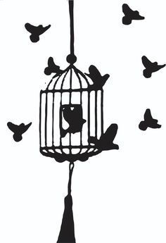 a bird cage with birds flying around it