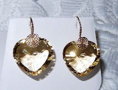 VERY RARE CUT, 49.07CTS NATURAL UNTREATED HEART CONCAVE CUT LEMON QUARTZ GEMSTONES, 14KT YELLOW GOLD HOOK PIERCED EARRINGS Each stone weighs approx. 24+cts. Measurements with hooks 1 1/8 inches long x 7/8 inch wide. Earrings come in an earring box & outer 2pc gift box. I will include a pair of clear rubber sleeves for the hooks, so you won't be in fear of losing the earrings while wearing them. I CAN CHANGE THE GOLD HOOK OUT FOR ANOTHER FINDING, PLEASE CONTACT ME BEFORE PURCHASE. STONE DETAILS S Pierced Heart Cut Earrings For Formal Occasions, Gold Heart Cut Earrings For Formal Events, Gold Heart Cut Earrings For Formal Occasions, Formal Yellow Gold Heart Cut Earrings, Elegant Gold Heart Earrings With Gemstone, Gold Heart-shaped Crystal Wedding Earrings, Elegant Yellow Heart Earrings, Elegant Gold Heart-shaped Crystal Earrings, Heart-shaped Gold Cubic Zirconia Earrings