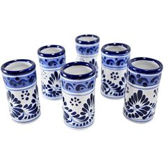 six blue and white cups sitting next to each other