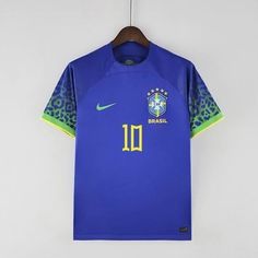 a soccer jersey hanging on a hanger with the brazil national team's logo