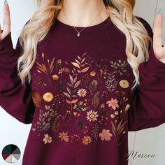 Autumnal Wildflowers Unisex Crewneck Sweatshirt | Botanical Wildflower Nature Lover Jumper | Autumn Sweatshirt  ✔️ Super comfy unisex heavy blend crewneck sweatshirt  ✔️ 50% cotton 50% polyester ✔️ Medium-heavy fabric (8.0 oz/yd² (271.25 g/m ✔️ No side seams ✔️ Ribbed knit elastic collar to help collar retain its shape ✔️ Sewn-in label 📏 Runs true to size ✨ Care instructions: Machine wash: cold (max 30C or 90F). Turn inside out before washing to protect the print. Non-chlorine: bleach as needed Floral Print Long Sleeve Sweatshirt For Fall, Cotton Floral Print Sweatshirt For Fall, Botanical Relaxed Fit Tops For Fall, Fall Cotton Sweatshirt With Plant Print, Cotton Sweatshirt With Plants Print For Fall, Botanical Style Cotton Sweatshirt For Fall, Botanical Long Sleeve Tops With Plant Print, Flower Shaped Relaxed Fit Sweatshirt For Fall, Relaxed Fit Flower Sweatshirt For Fall