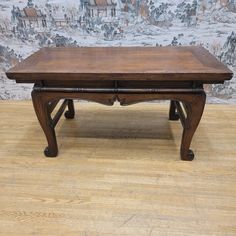 an old wooden table with two drawers on the top and one drawer at the bottom