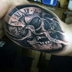 a man with a clock and skull tattoo on his arm