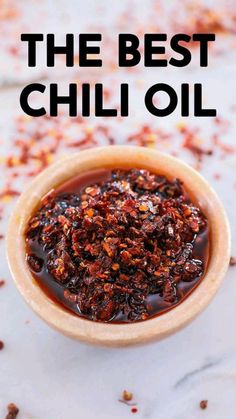 the best chili sauce in a small wooden bowl on a marble surface with text overlay