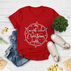 "My favorite Color is Christmas Lights, Christmas T-Shirt, Christmas Tshirt, Christmas Lights Shirt, Winter Time Shirt, Christmas Gift Shirt Hi!  Welcome. It's great to see you here! ☺️ Our shirts are clean, high quality and soft. It is prepared quickly by our boutique.  Ironing and shipped.  Enjoy your shopping! It is a pleasure for us to help you with your questions and you can reach us at any time. Please, don't forget to check our size cards. HOW TO ORDER SHIRT 👕 Please, choose your favorit My Favorite Color Is Christmas Lights Shirt, Christmas Concert, Happy New Year 2024, Christmas Tshirt, Lights Christmas, My Favorite Color, Christmas Song, Jesus Shirts, Christmas T Shirt