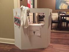 a cardboard box with a white shirt on it and a sign that says open to doctors office