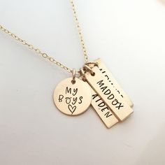 "My Boys - hand stamped personalized necklace - mothers necklace - Gift for Mom of Boys - Gold Filled Mommy Necklace - Gold Mom Necklace 1 5/8\" gold filled disc stamped \"my boys\" 1\" gold filled rectangle name tags (You choose how many name tags you need from the drop down box) The charms hang from a gold filled cable chain. Info to include in the notes to seller during checkout: names/words to stamp on each charm length of chain (16, 18 or 20 inches) As with all hand stamped jewelry, each pi Mother Necklaces, Grandmothers Necklace, Watch Charms, Mother Necklace Personalized, Homemade Items, Mommy Necklace, Mom Of Boys, Custom Charm Necklaces, Stamped Necklaces