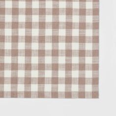 a brown and white checkered table cloth