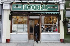 a man standing in front of a store