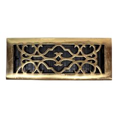 an antique brass register cover with decorative design