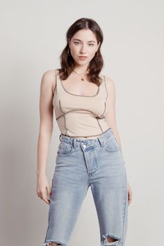 A crop tank top with striking details. This Sand Contrast Exposed Stitch Crop Tank Top shows off your best features. Shop TOBI clothing, contrast stitch tops, and exposed stitch tops in the hottest trends. Get the latest in women's tank tops in the most popular styles. Beige Crop Tops