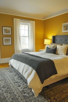 a bedroom with yellow walls and white bedding in the center, along with two lamps on either side of the bed