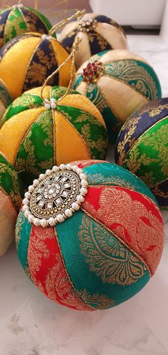 several colorful ornaments are sitting on a table