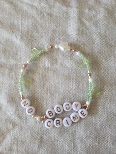 a beaded bracelet with words written on it and beads around the word'boody creme '