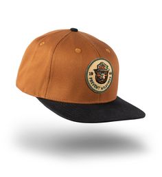 Adjustable snapback flatbill design with a vintage-style felt embroidered front patch for timeless style. Custom felt front patch Snapback closure For best use, expose to wild air and sights unseen Vintage Trucker Hat With Logo Patch, Outdoor Trucker Snapback Hat With Patches, Vintage Trucker Hat With Logo Patch And Flat Brim, Casual Hat With Logo Patch And Flat Crown, Casual Hats With Logo Patch And Flat Crown, Outdoor Logo Patch Baseball Cap, Casual Flat Crown Hats With Logo Patch, Casual Outdoor Snapback Hat With Patches, Trucker Snapback Hat With Patches For Streetwear